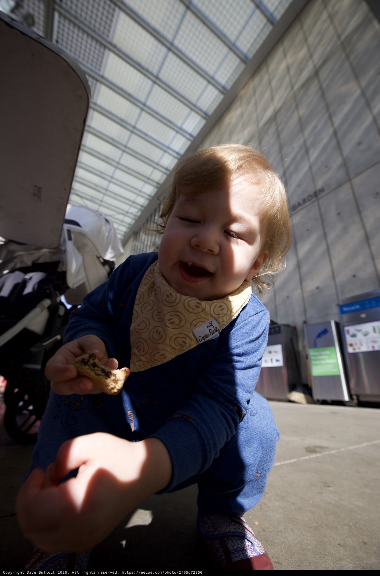 Toddler Enjoying a Snack at Transit Station