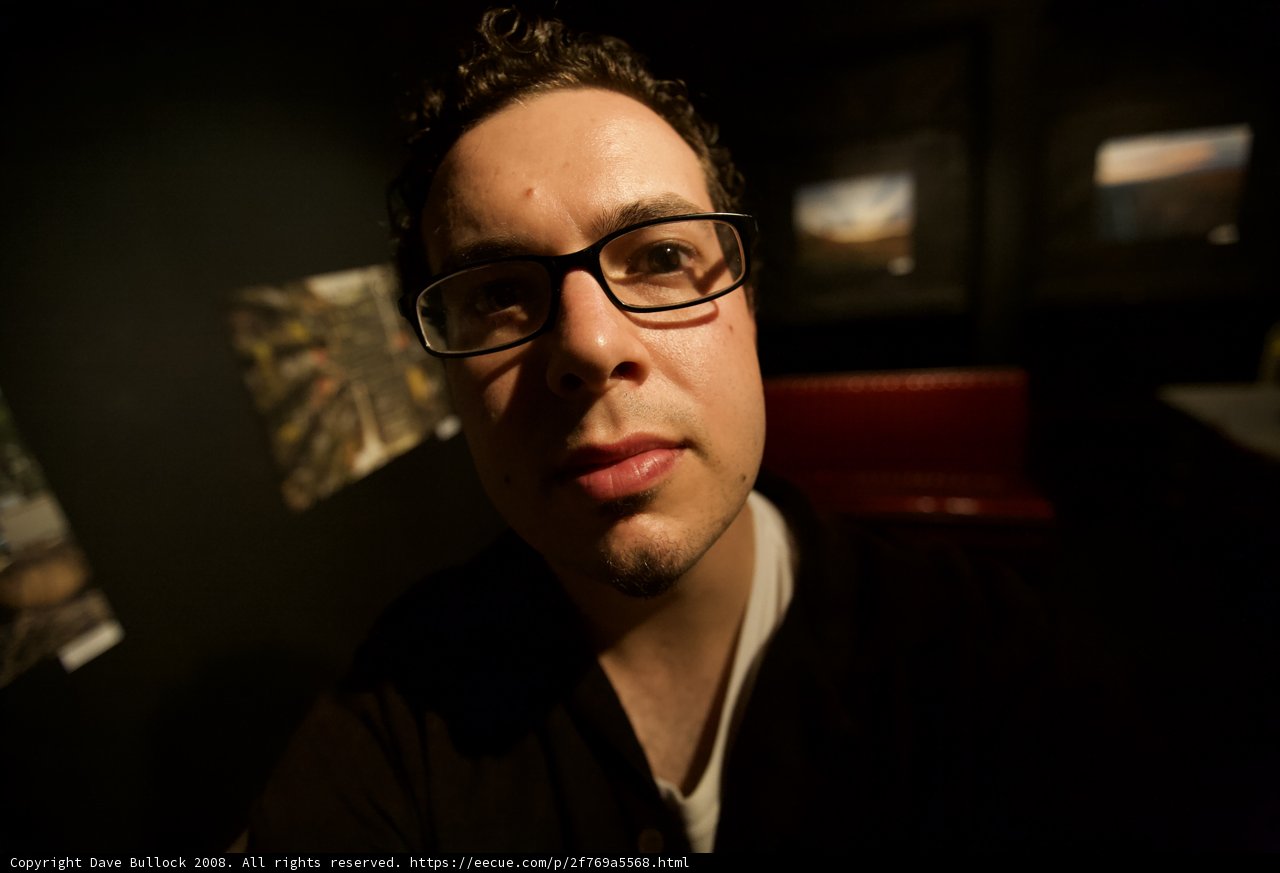 A Portrait of a Man with Glasses