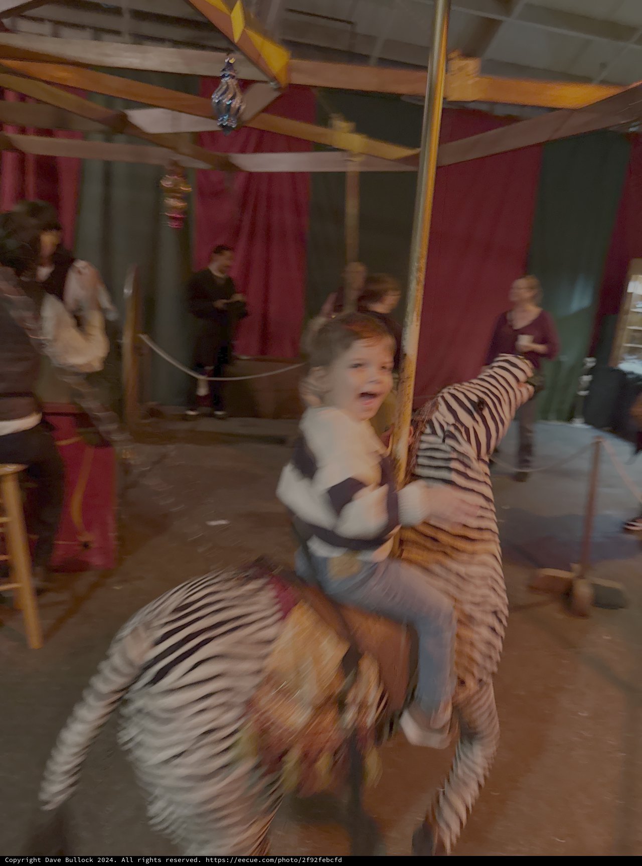 Child Riding Carousel Tiger in Motion