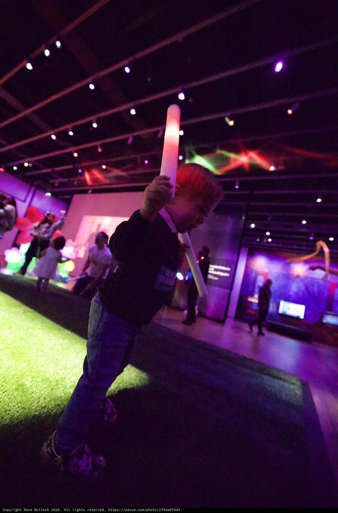 Child with LED Sword at Baby Rave Event