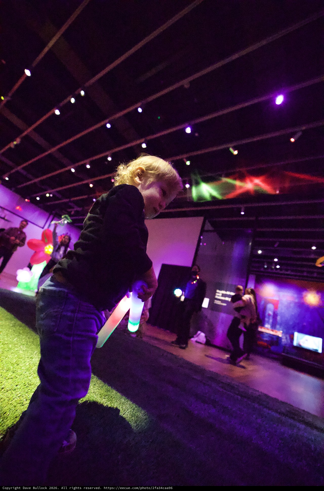 Child at Baby Rave Event with Glow Stick