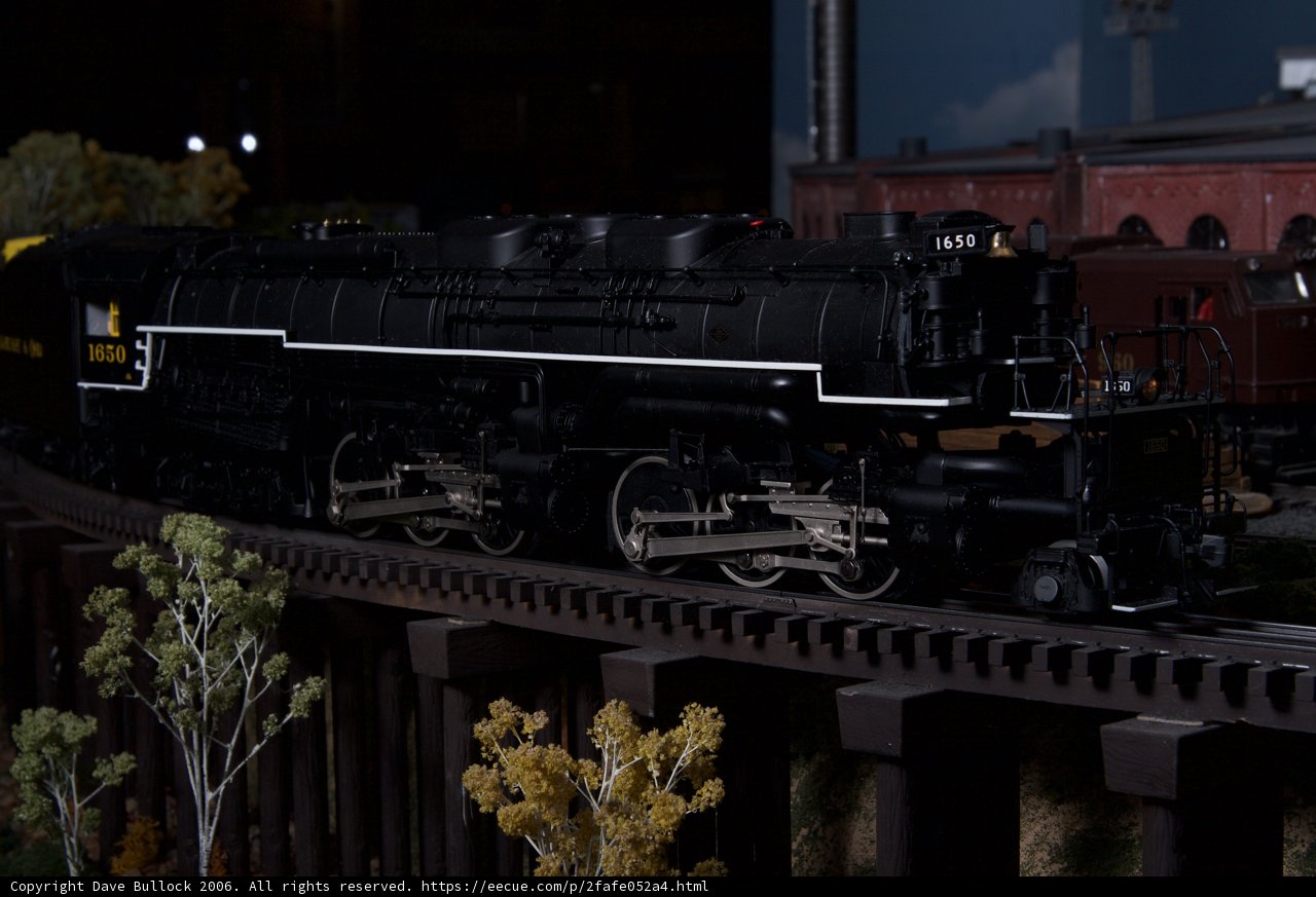 Black Locomotive Chugging Down the Tracks