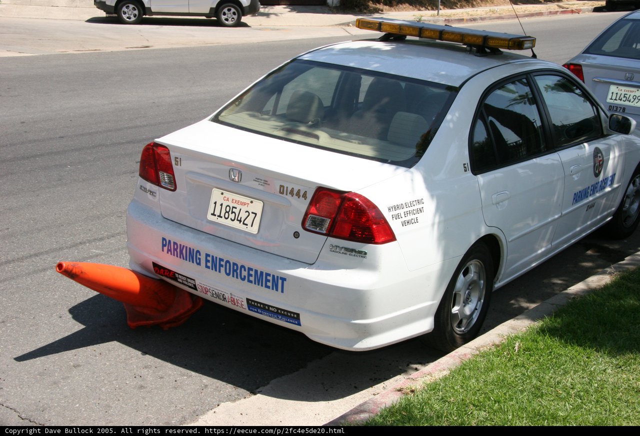 Parked White Sedan on the Road
