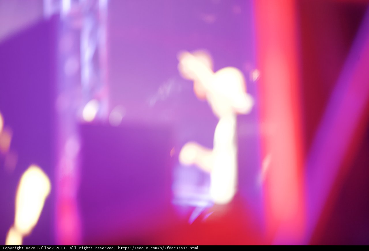 Blurry Solo Performance in Purple Spotlight