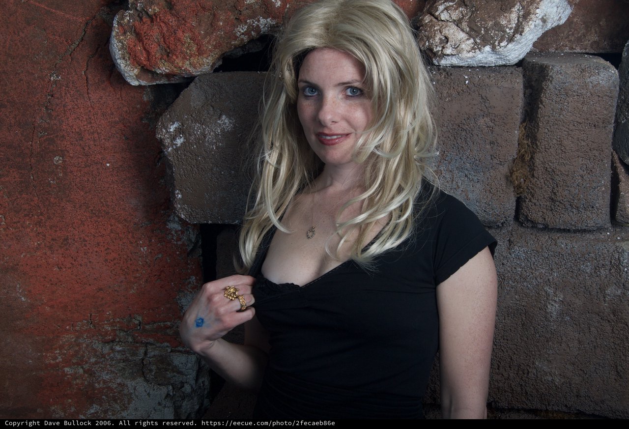 Blonde Halloween Costume Portrait Against Stone Wall