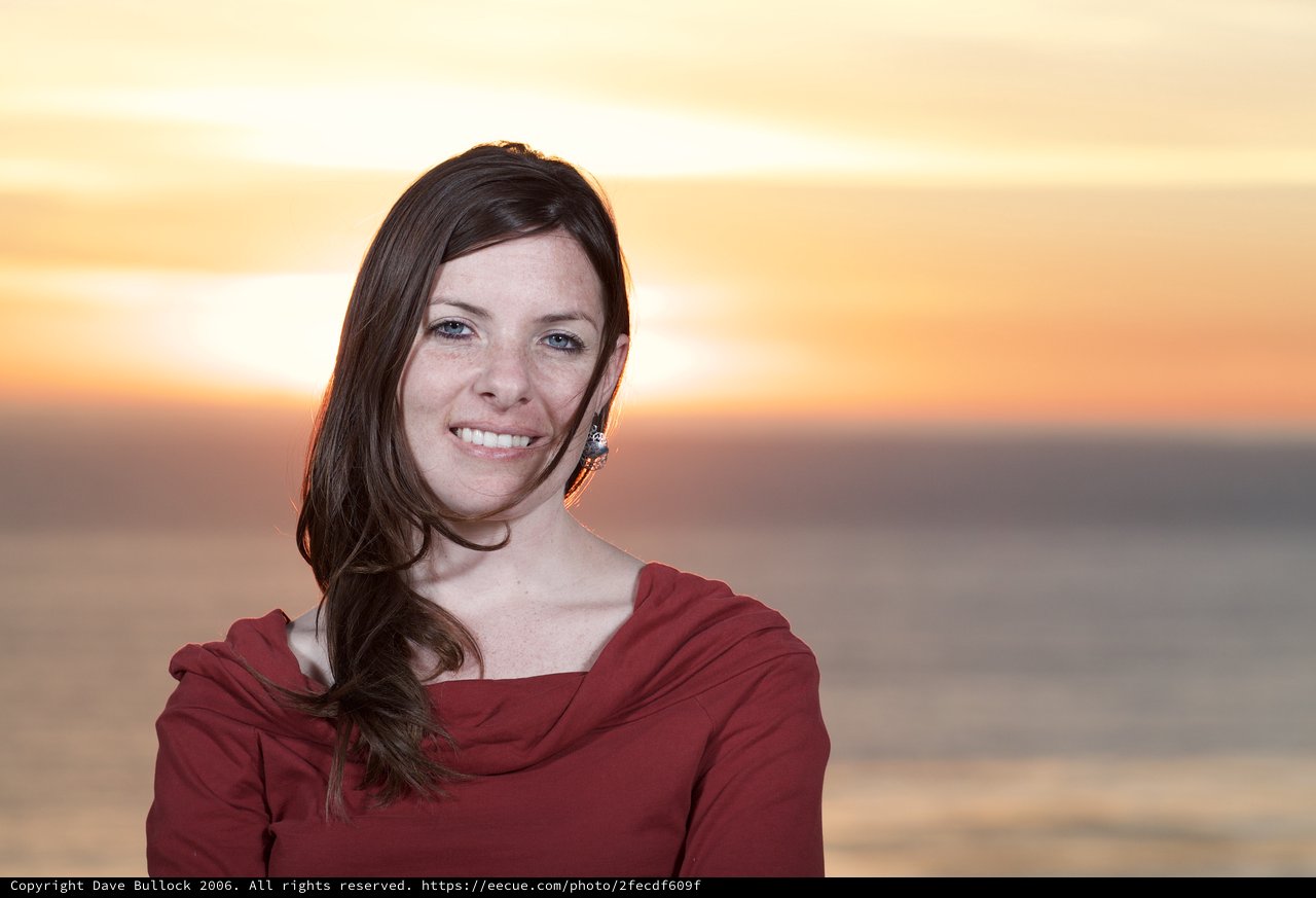 Smiling Woman at Golden Hour by the Sea