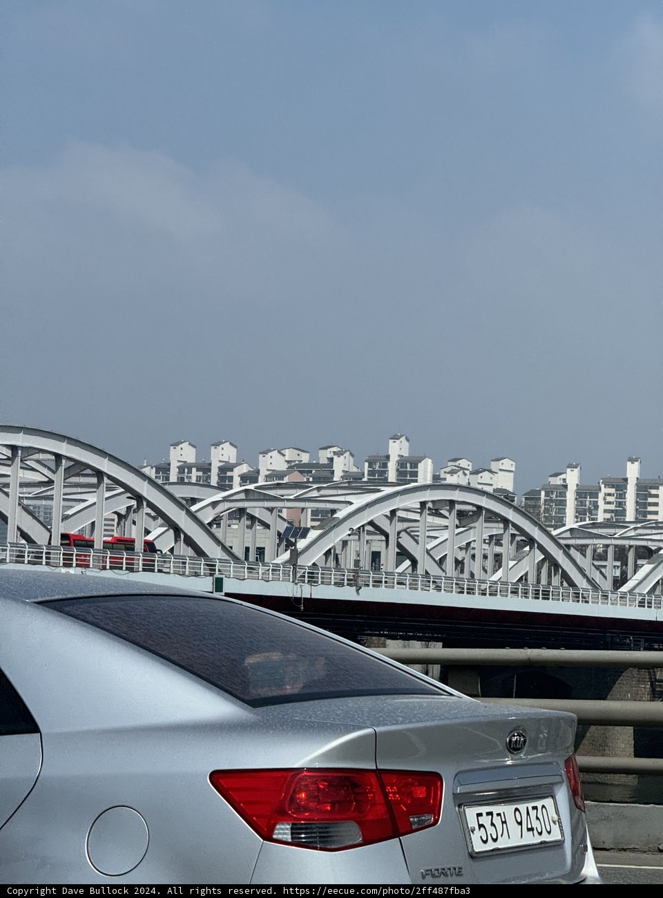 Urban Solitude: A Serene Moment on Seoul's Bridge