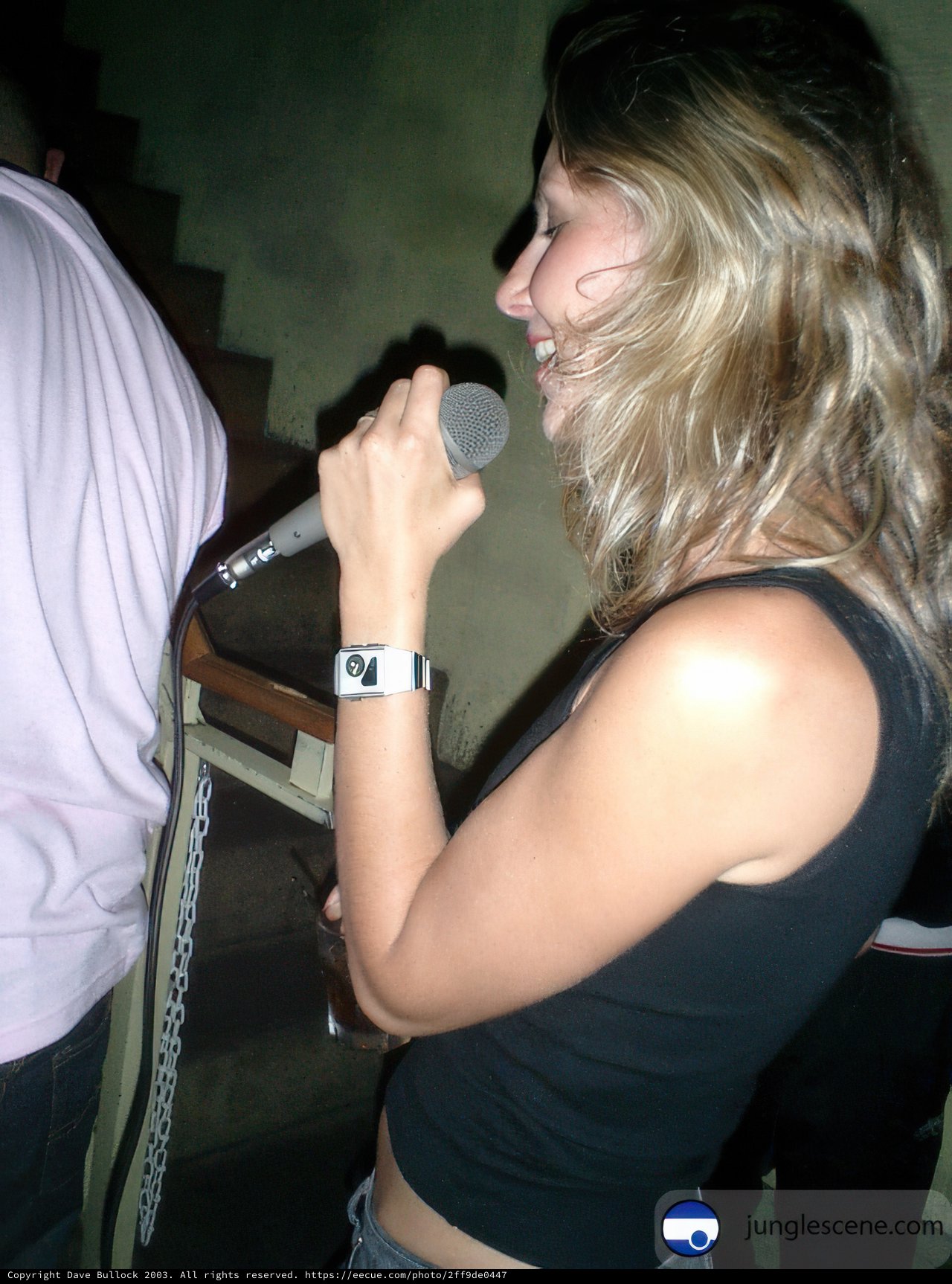 Singer Valida C. Performing with a Microphone