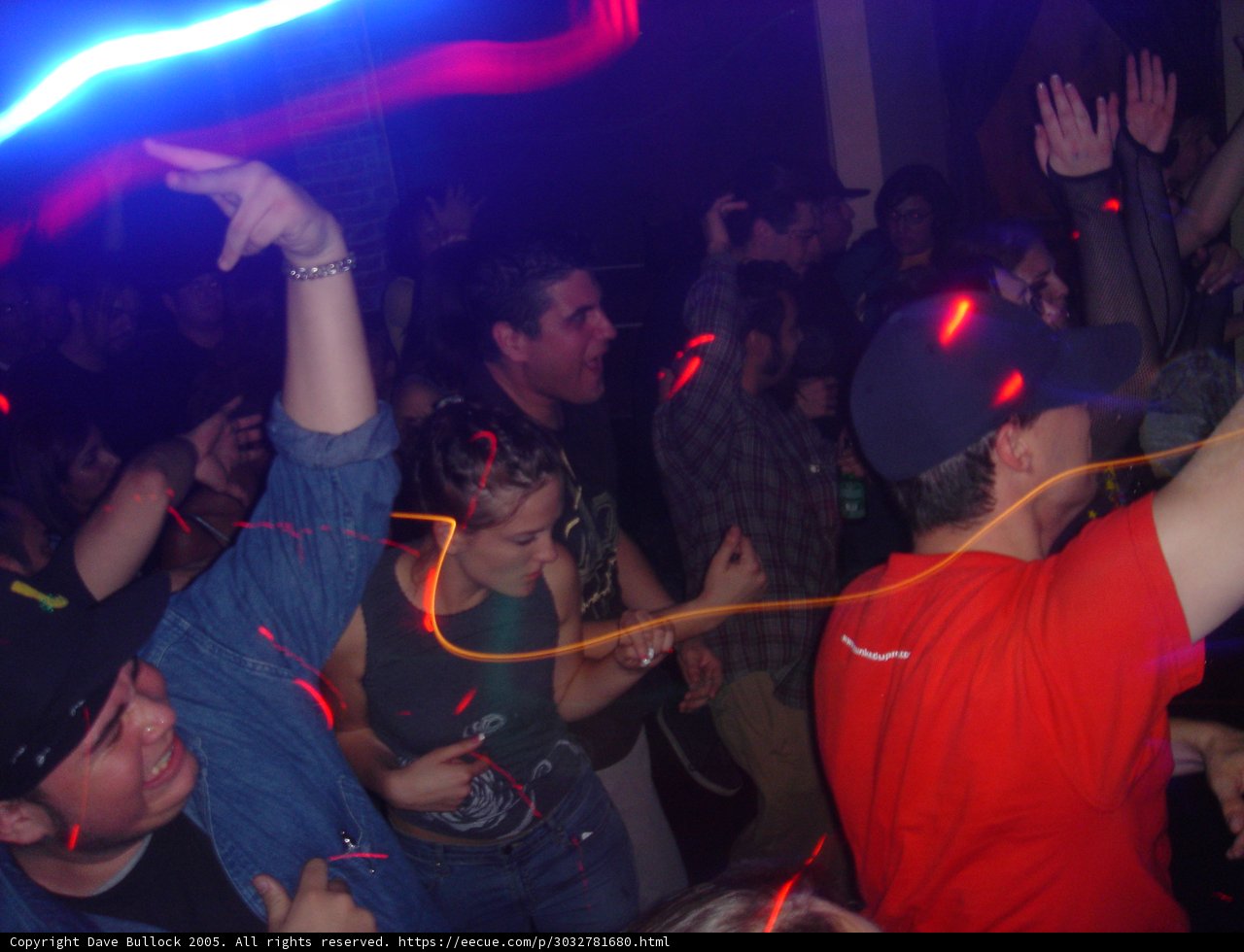 Red-shirted man stands out in Club crowd