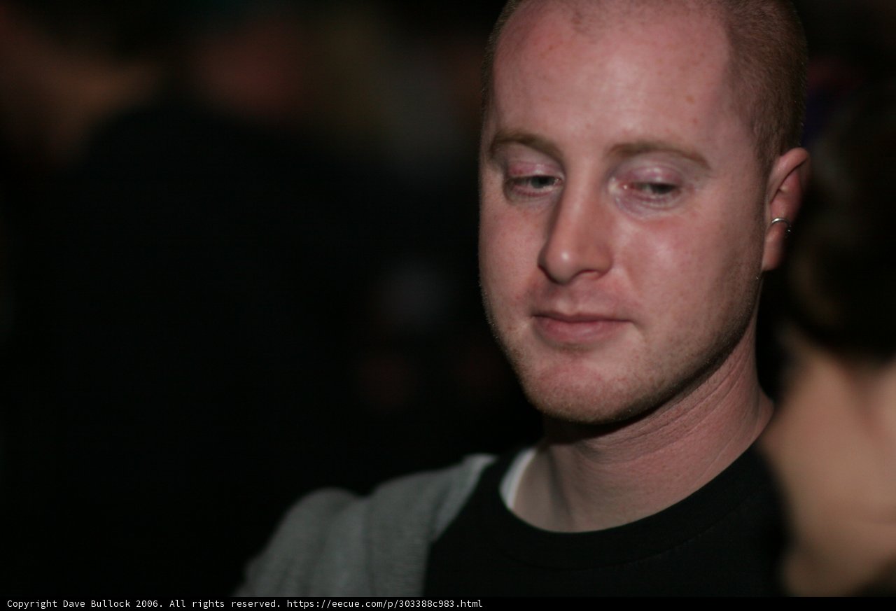 Bald Headed Man in Black Shirt