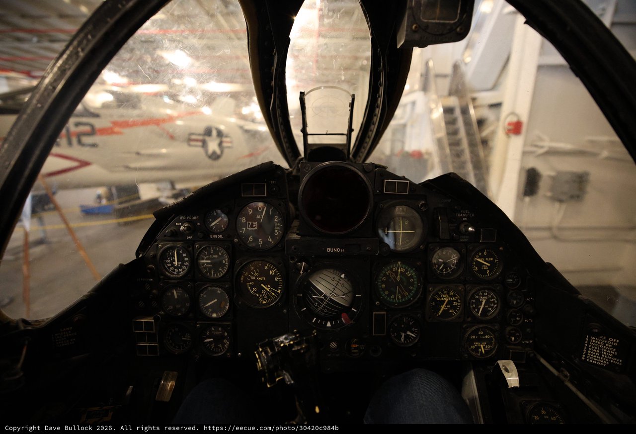 Fighter Jet Cockpit View with Vintage Aircraft Display