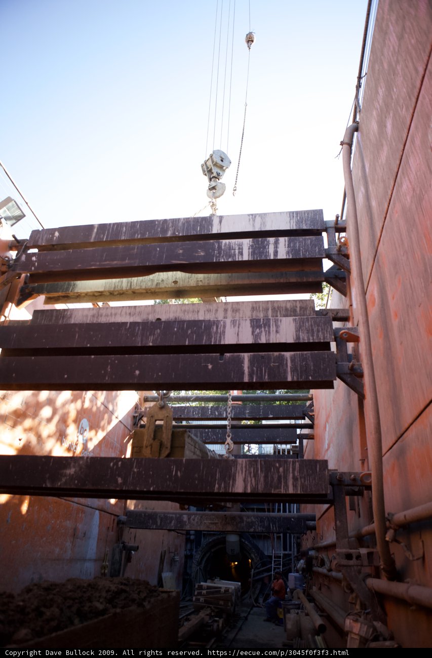 Lifting a Metal Piece on a Blue Sky Morning