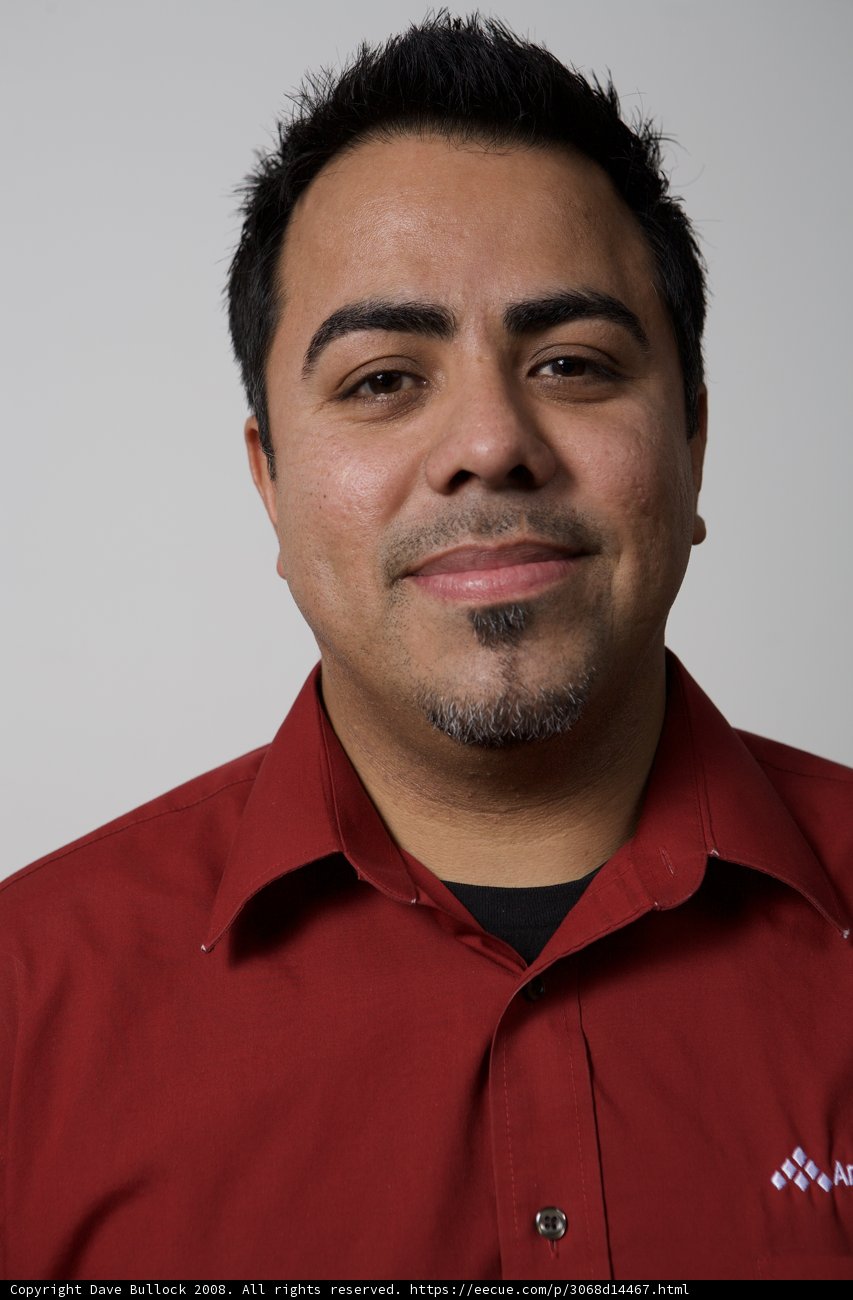 Smiling Man in a Red Shirt