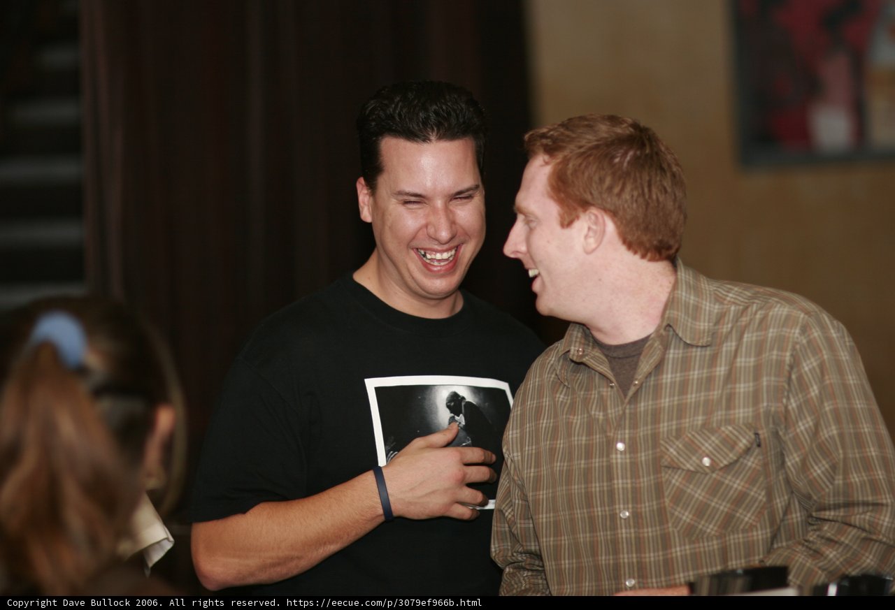 Two Men Enjoying a Cup of Coffee