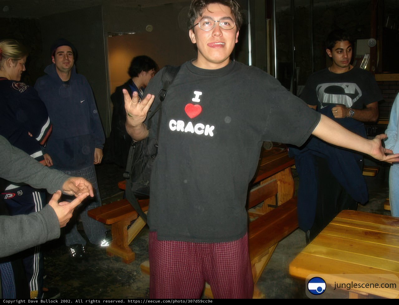 Man in Black Shirt Takes a Seat