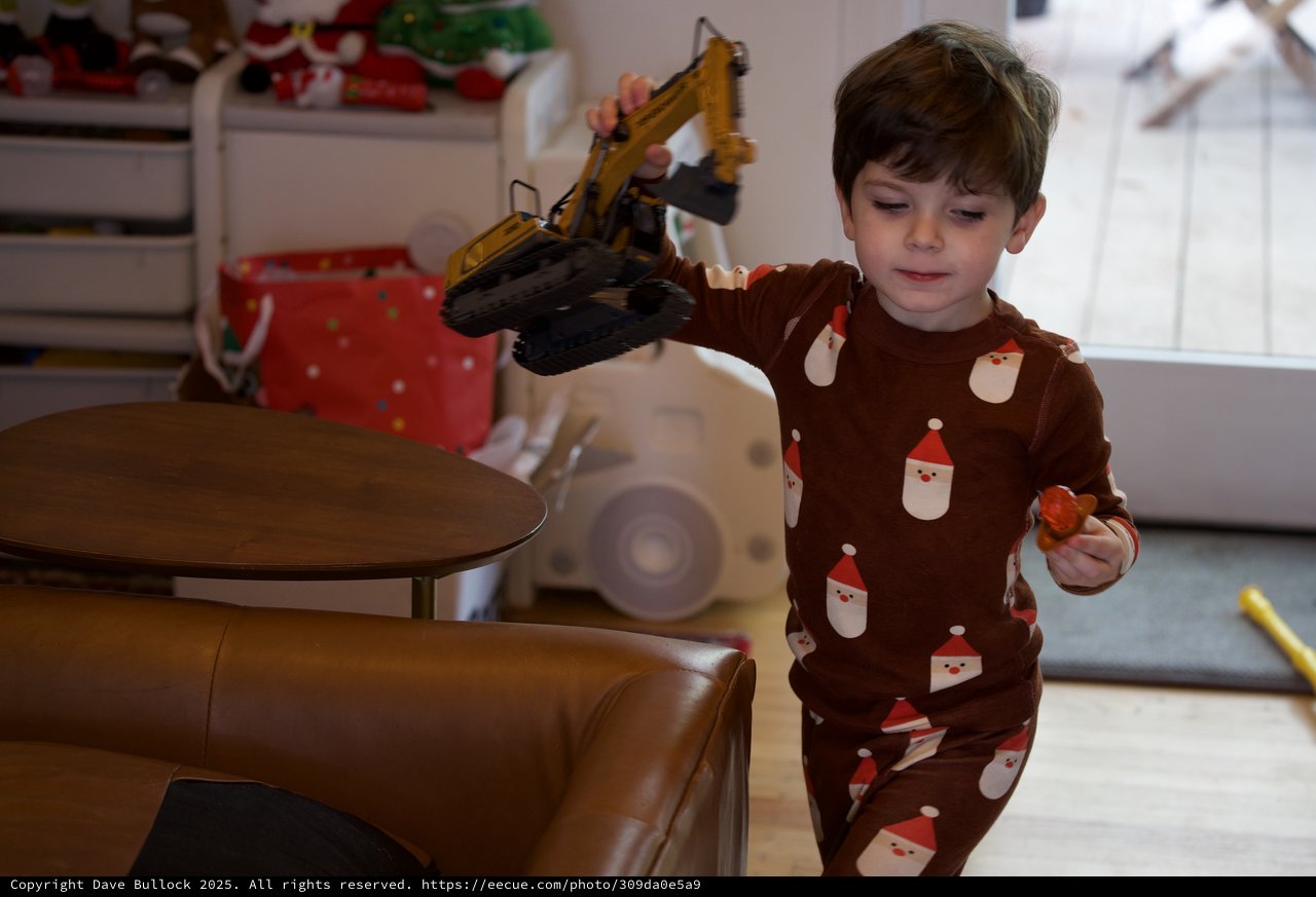 Boy Playing with Toy Excavator on Christmas Eve