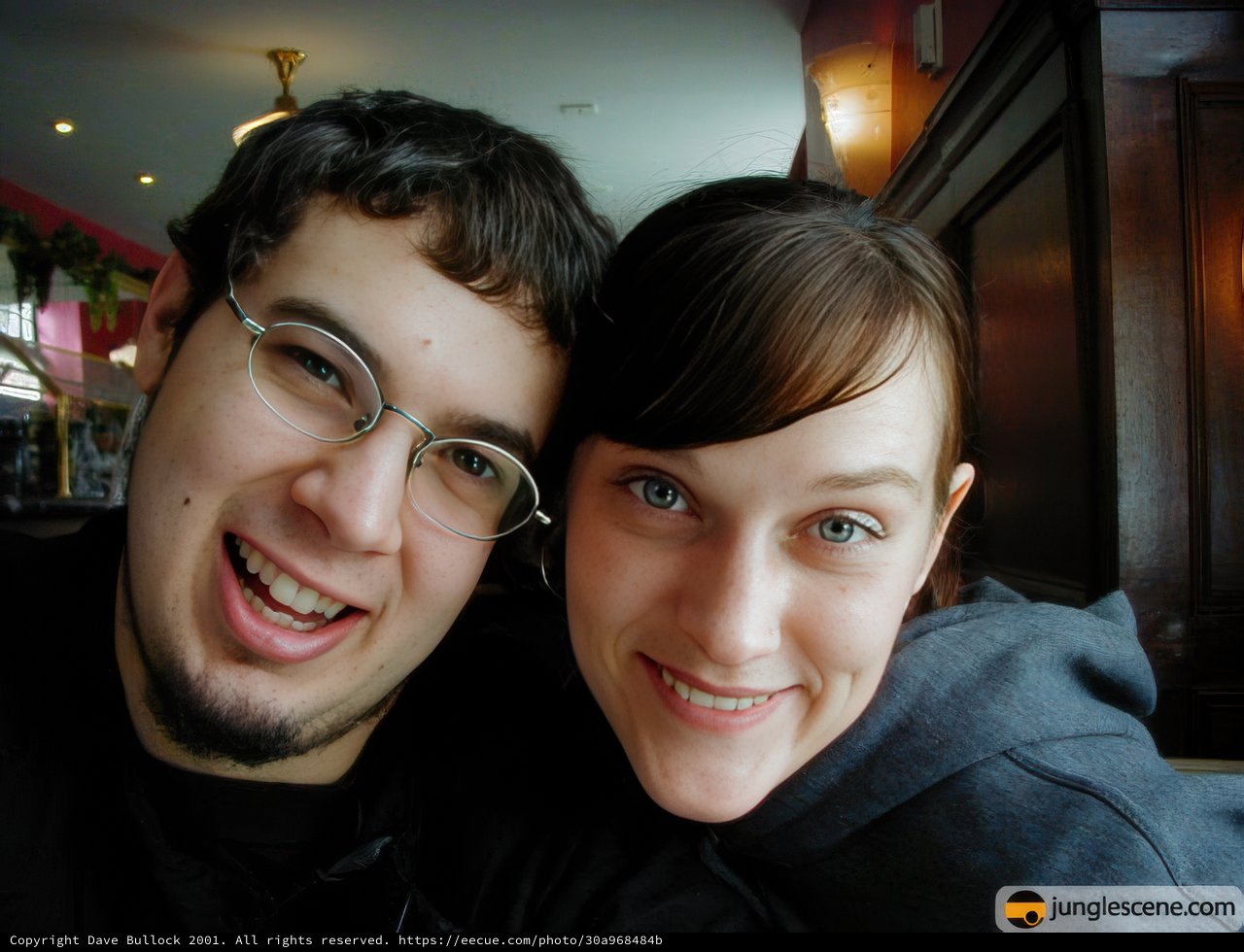 Smiling Couple Poses for New Year's Eve Selfie