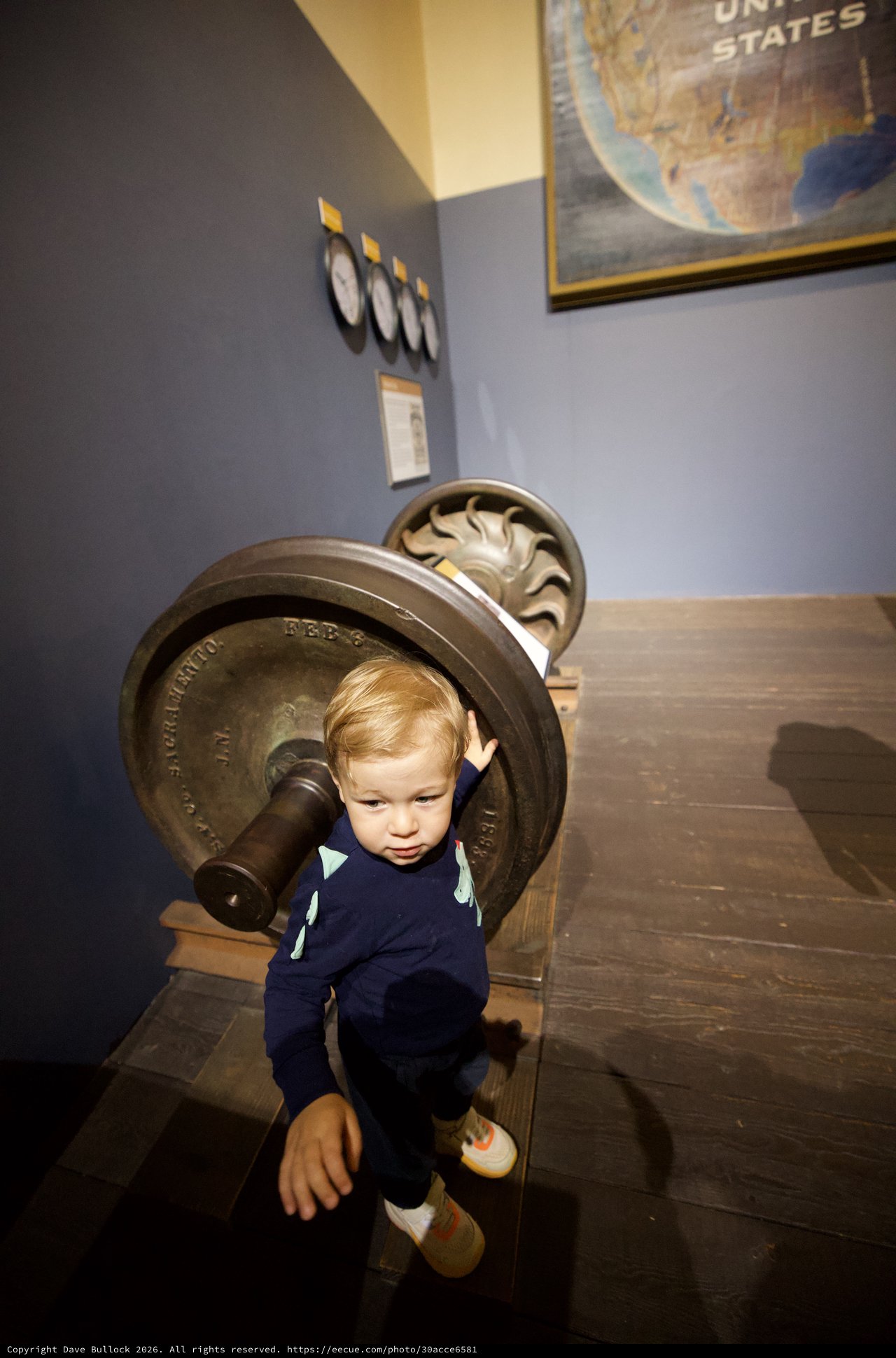 Toddler Exploring Vintage Naval Cannon at Museum