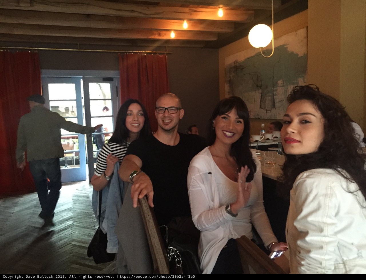 Friends Posing Together at a Trendy Restaurant