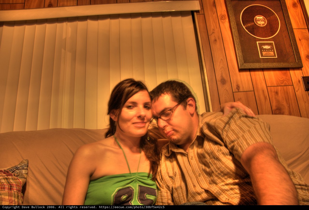 Couple Relaxing Together on Couch in Warm Light
