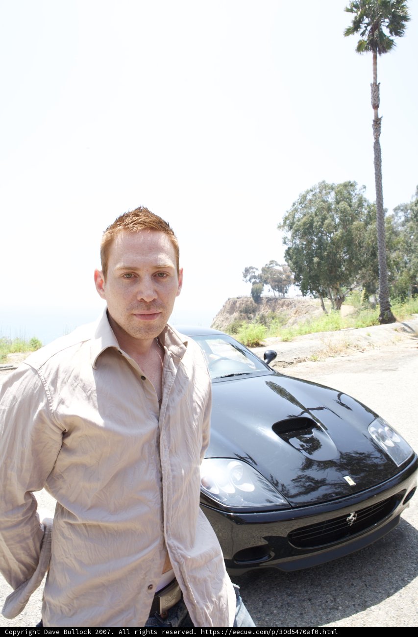 The Suave Driver and his Black Sports Car