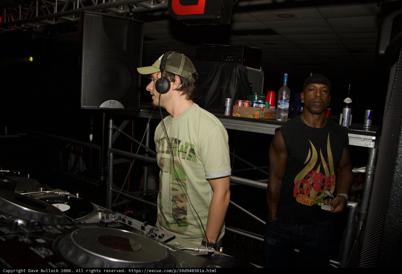 Green Shirted Deejay in a Nightclub