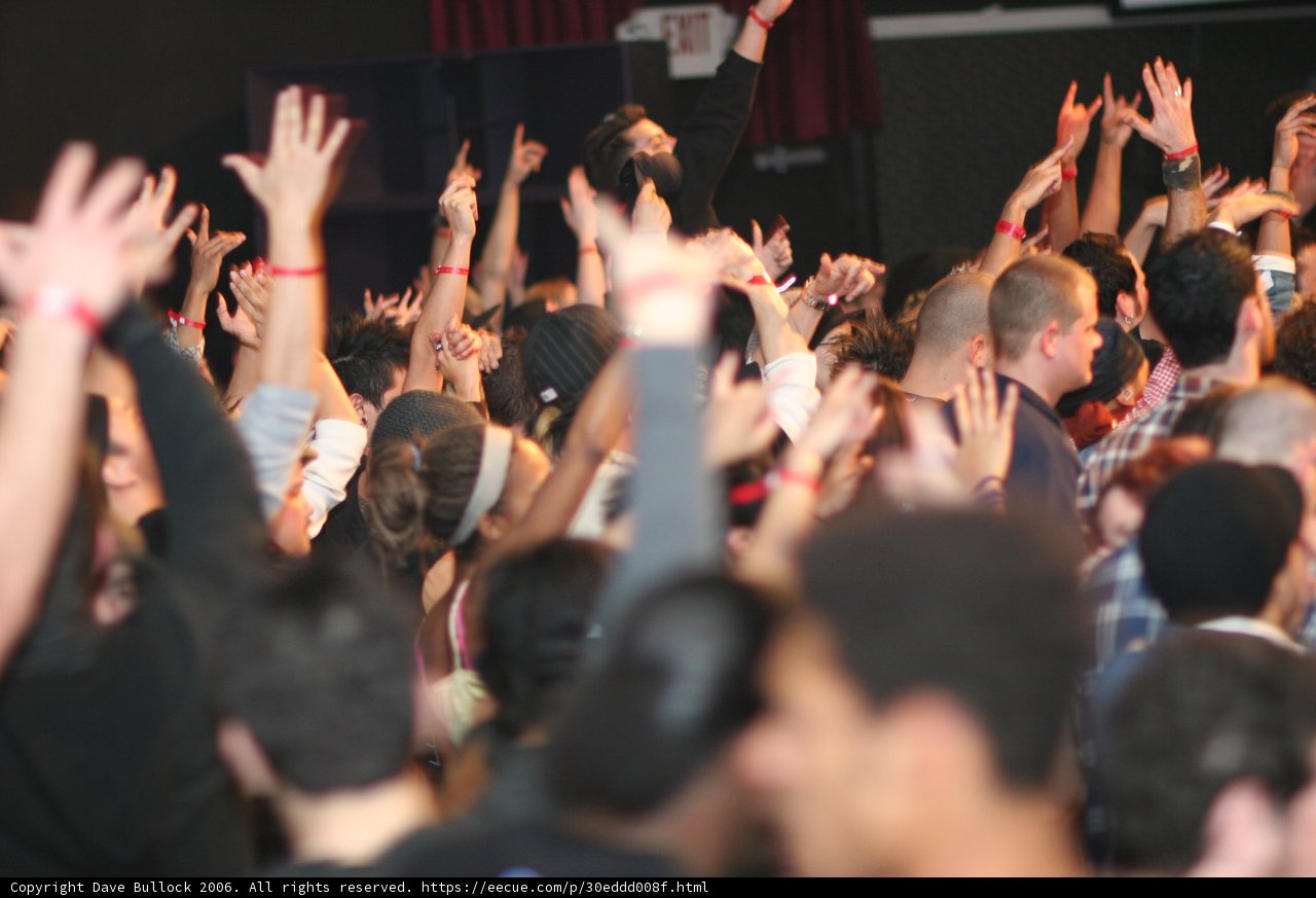 Urban Concertgoers Raise Their Hands in the Air