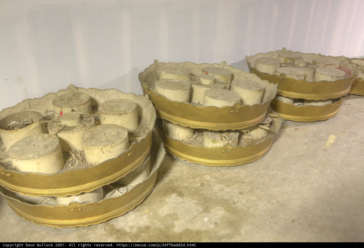 Golden Containers Contrasting with Concrete