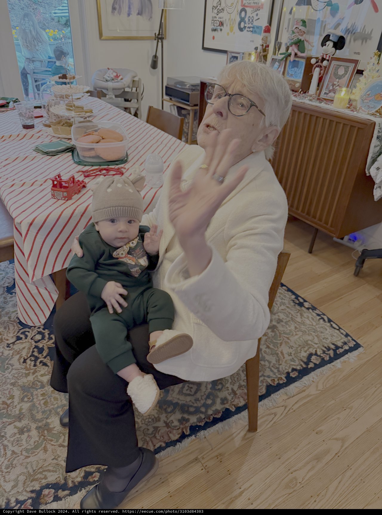 Grandmother and Baby Share Tender Kitchen Moment
