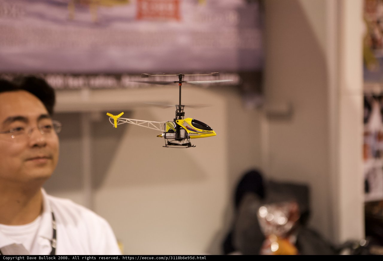 Marveling at the Helicopter Toy