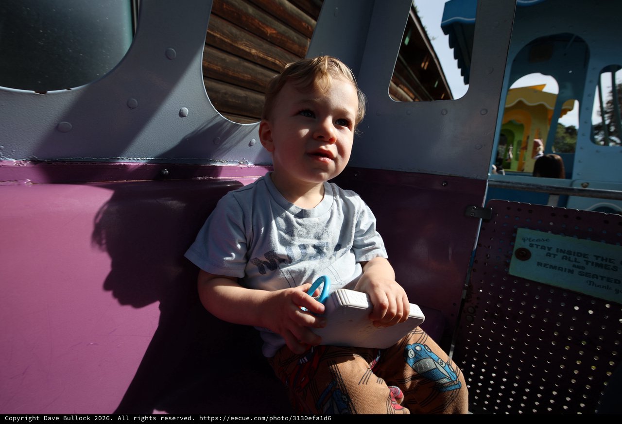 Young Child Enjoying Playground Adventure in Fantasyland