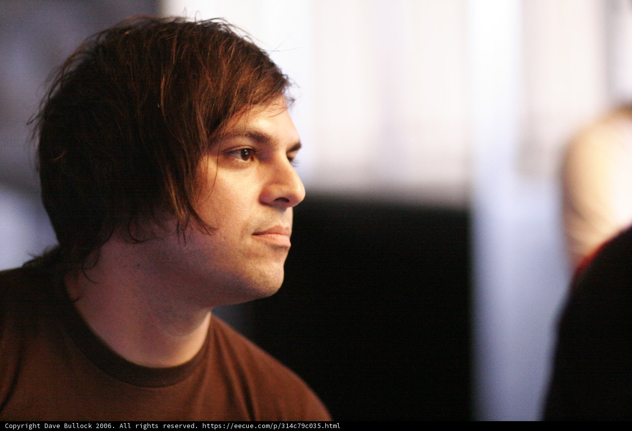 Long-Haired Man with a Brown Shirt