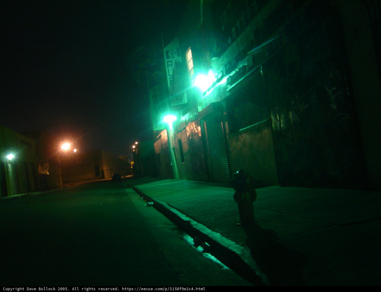 Illuminated Fire Hydrant in the Urban Night