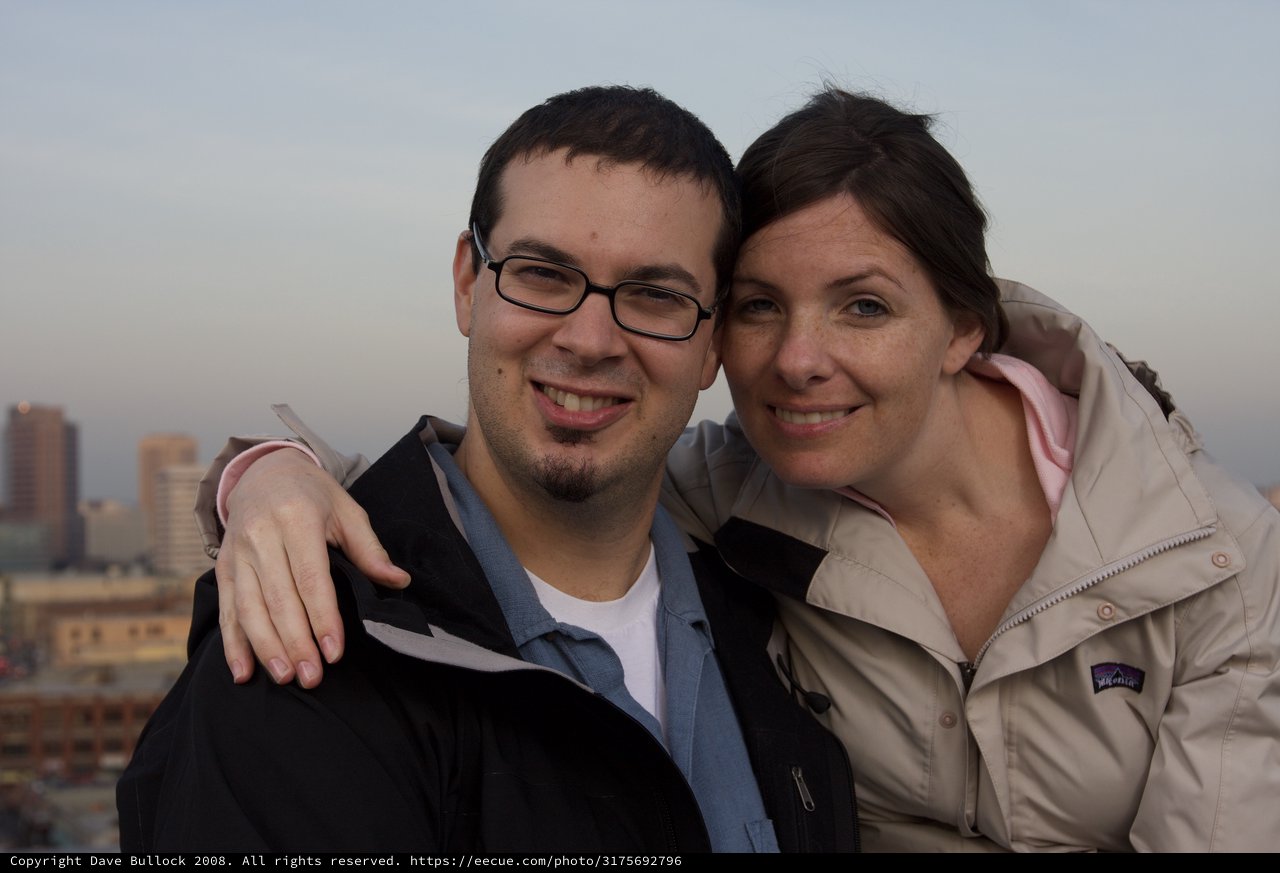 Couple Smiling Together Against City Skyline