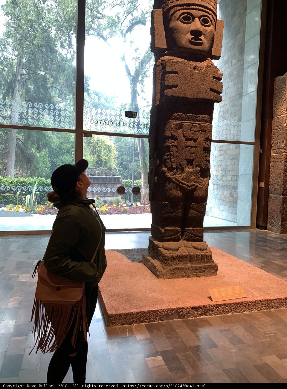 Standing with Symbolic Stone Statue
