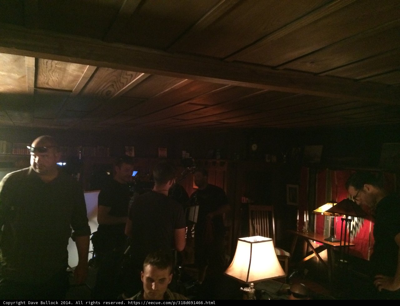 Gathering of Men in a Lighted Pub
