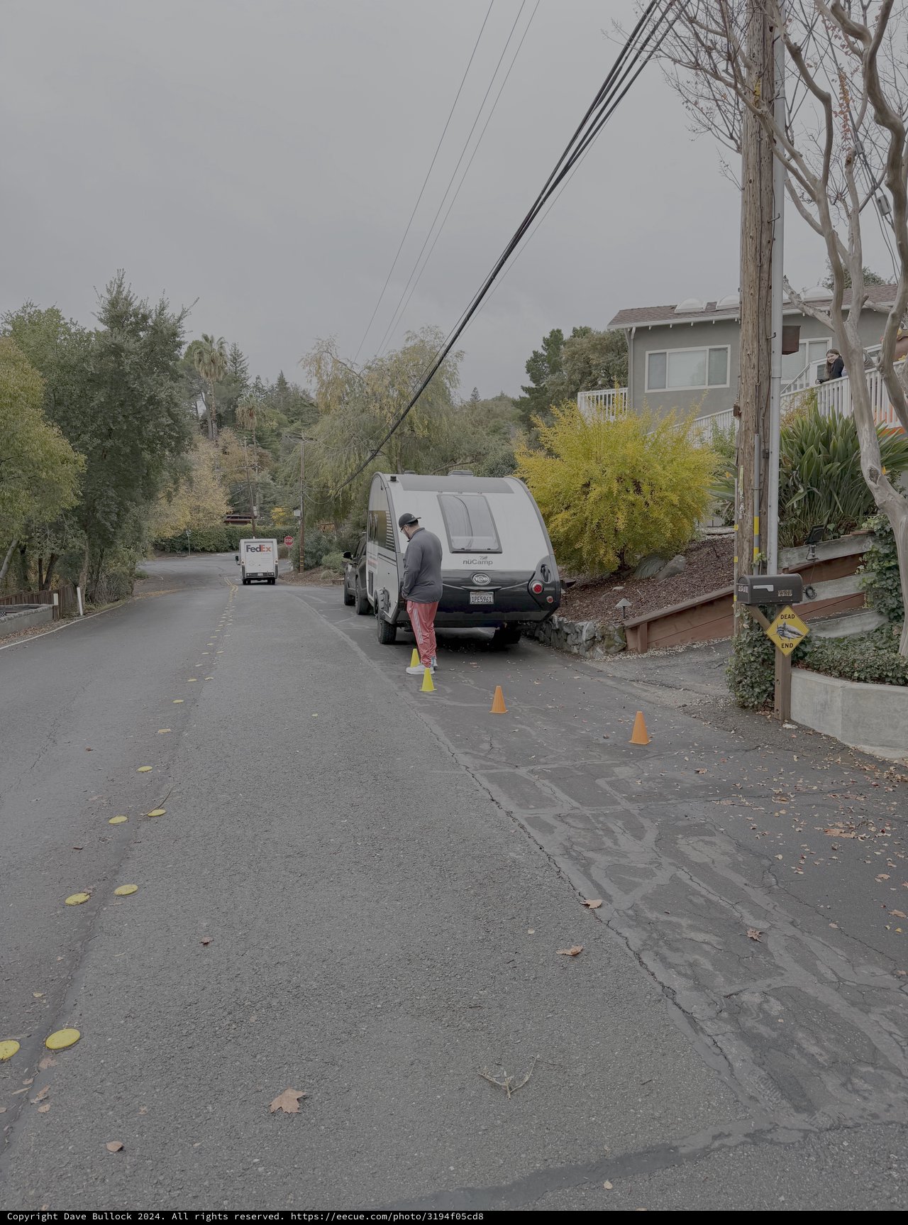 Utility Worker Managing Power Lines on Residential Street