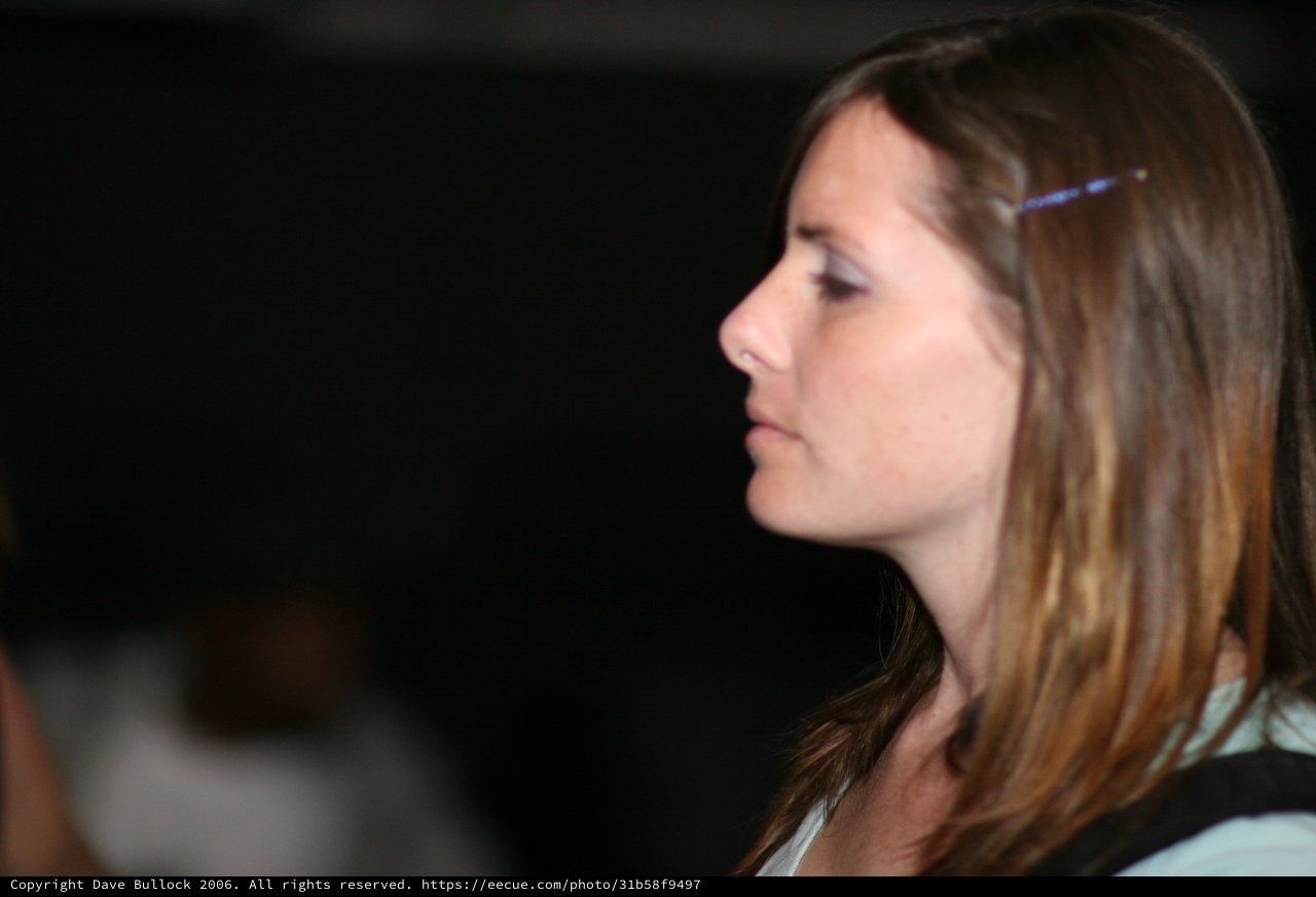 Woman in Profile Gazing into Darkness