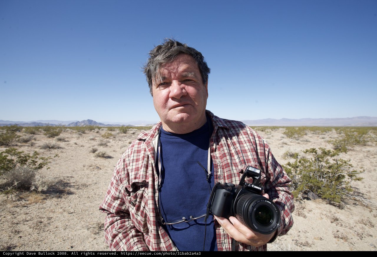 Desert Photographer Stands in Arid Mojave Wilderness