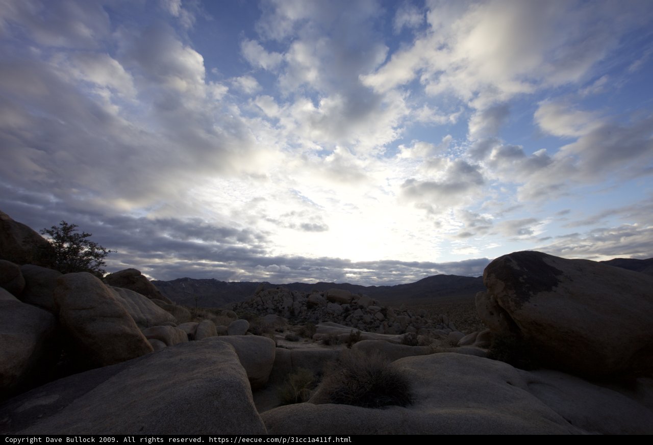 Rocky Terrain with Majestic Blue Sky and Clouds