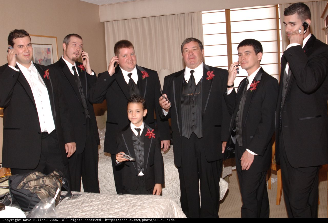 Groomsmen All on Cell Phones Before Wedding