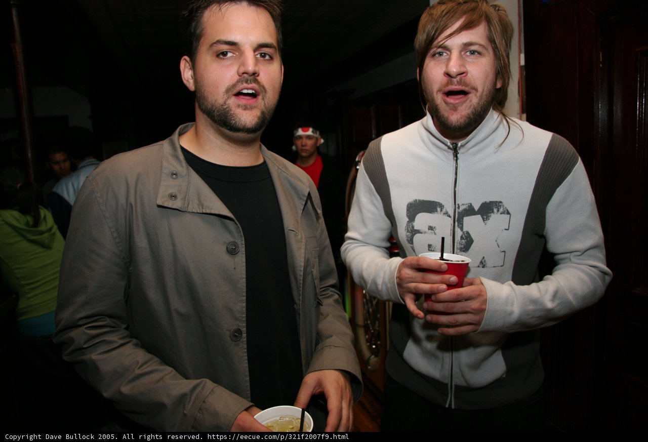 Grey Jacketed Man with Friends