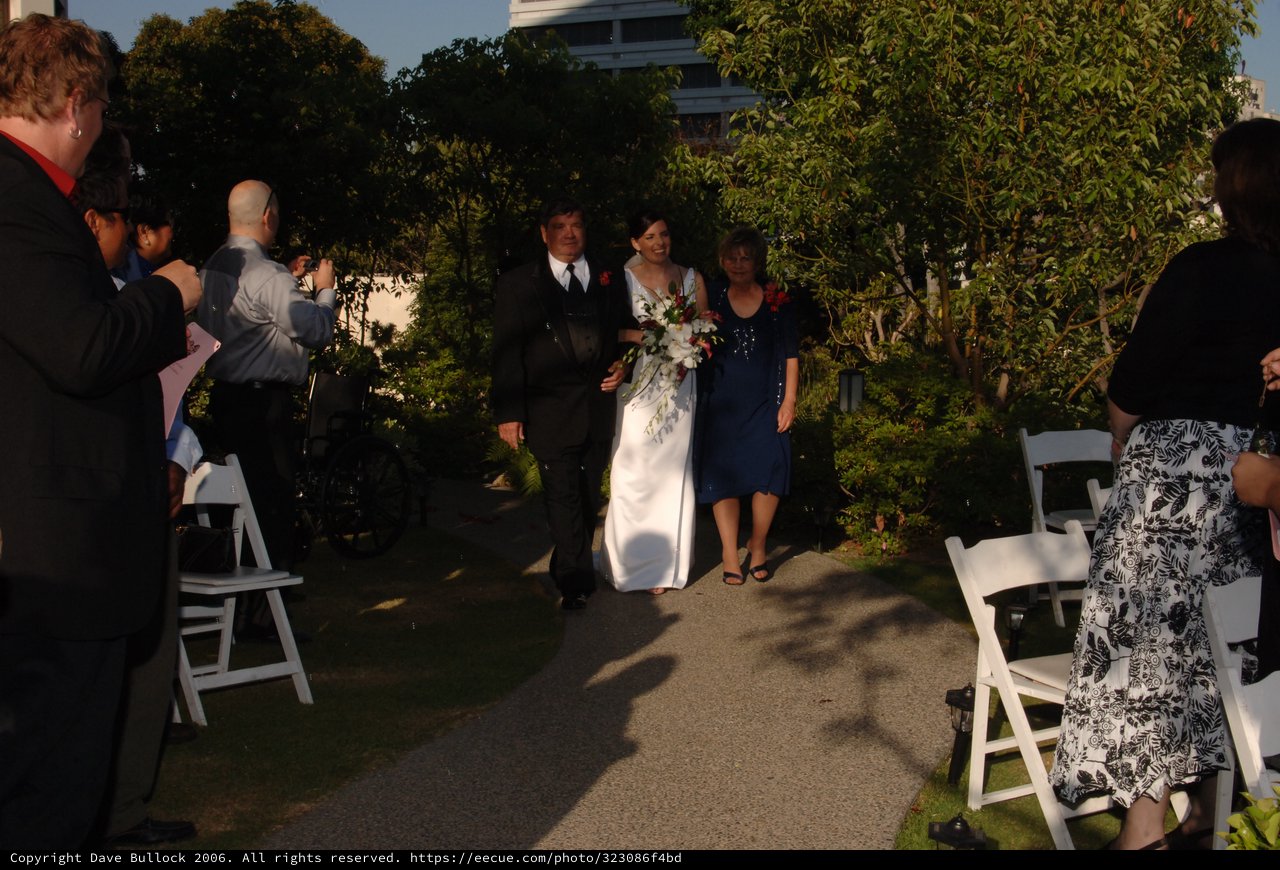 Bride Walks Down the Aisle with Parents