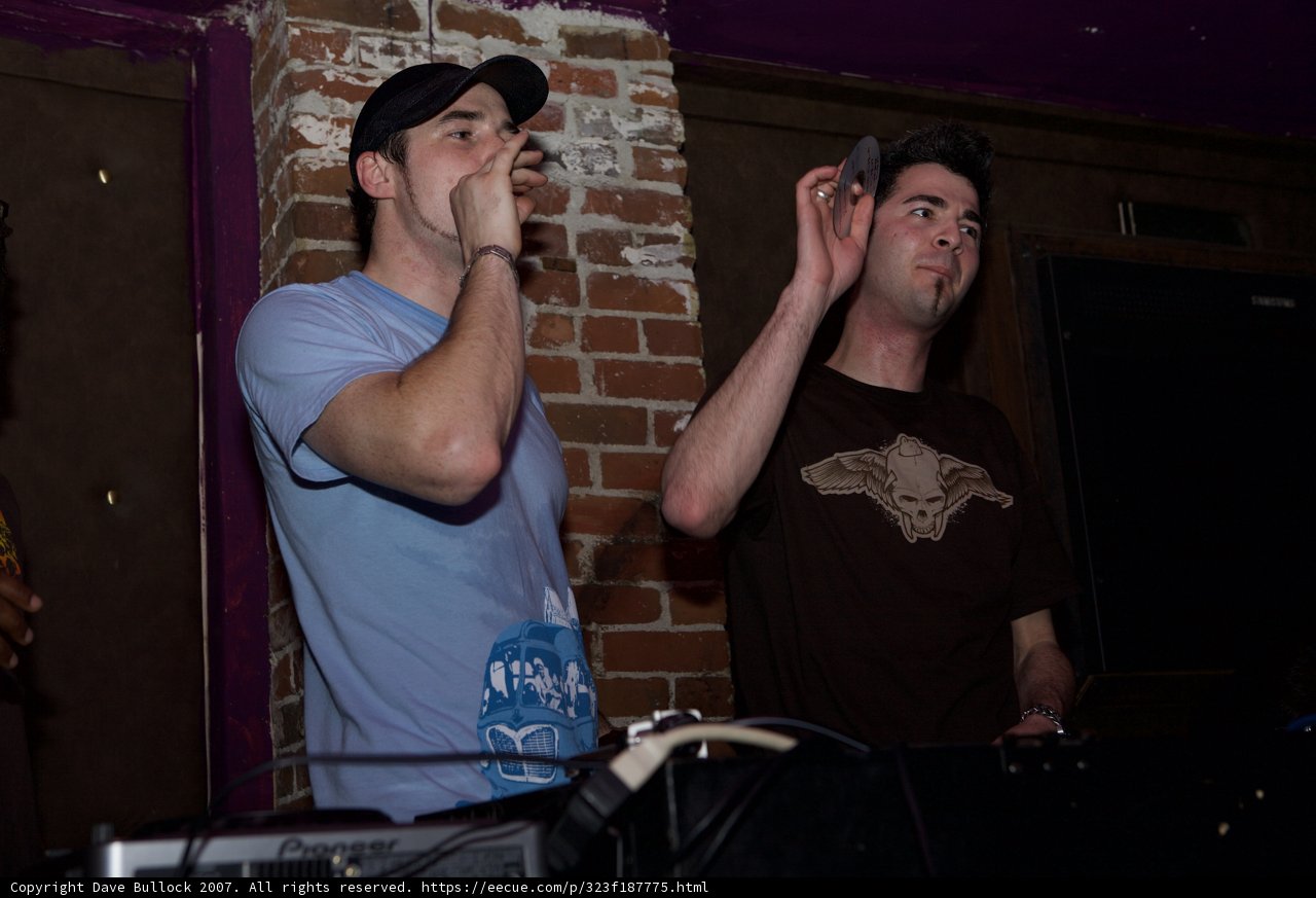 Two Men Entertain a Crowd with Music