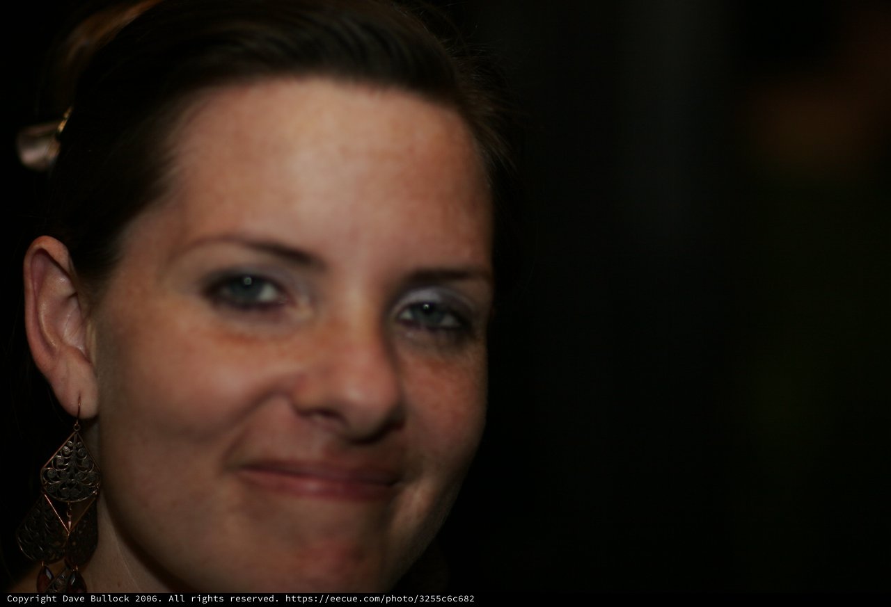 Penelope's Warm Smile in Low-Light Portrait