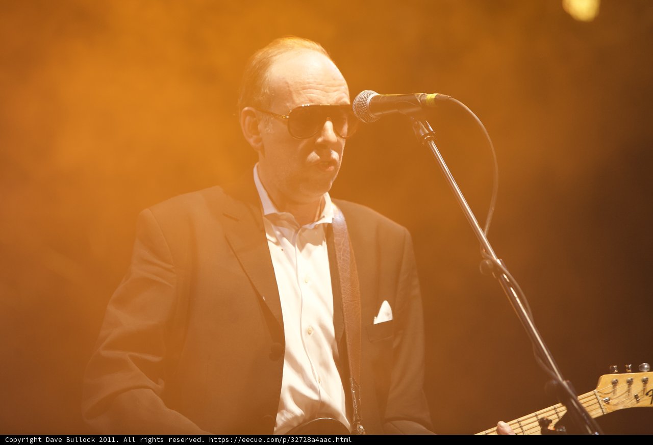 Mick Jones Rocks Coachella Stage with Guitar and Suit