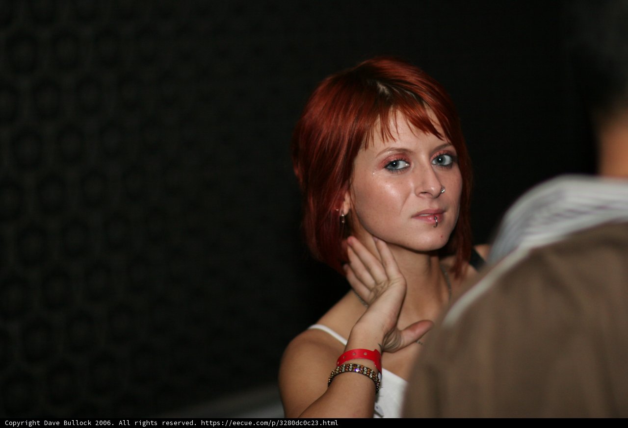Red-haired Woman with Finger Accessories