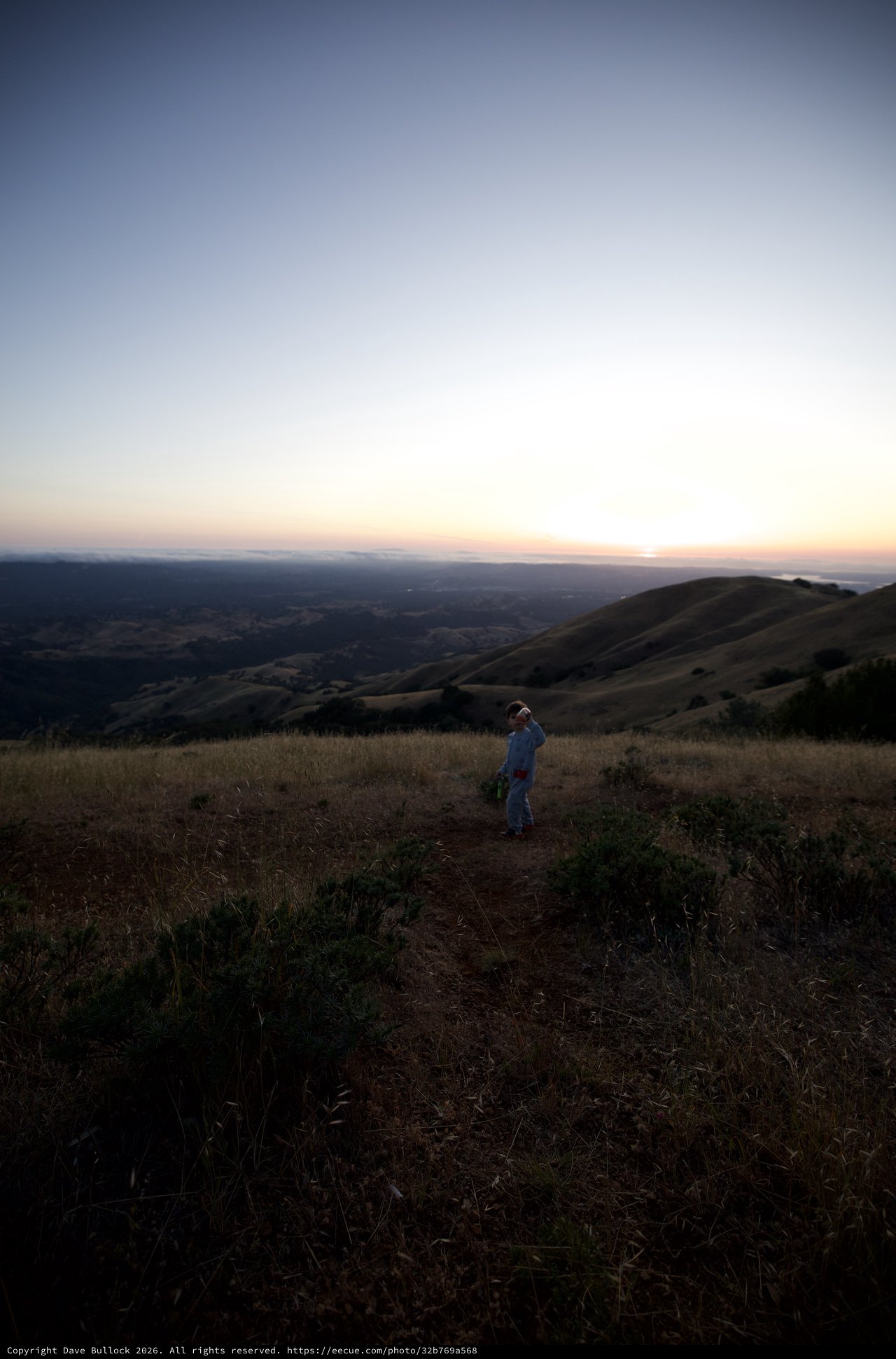 Child Gazing at Twilight Over Rolling California Hills