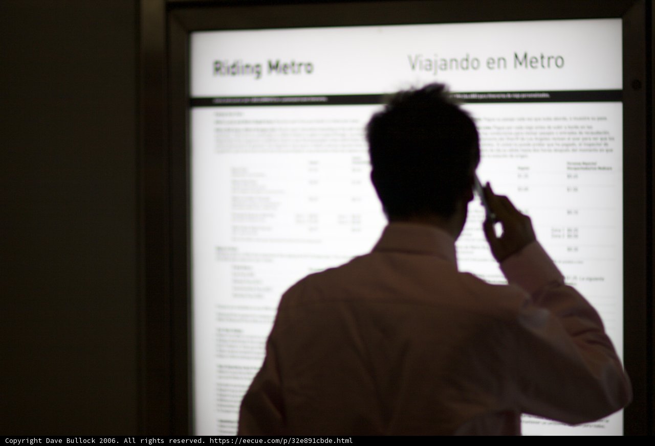 Man in Formal Wear Looking at a Computer Screen