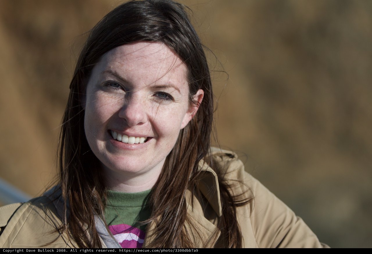 Smiling Woman Outdoors on a Sunny Winter Day